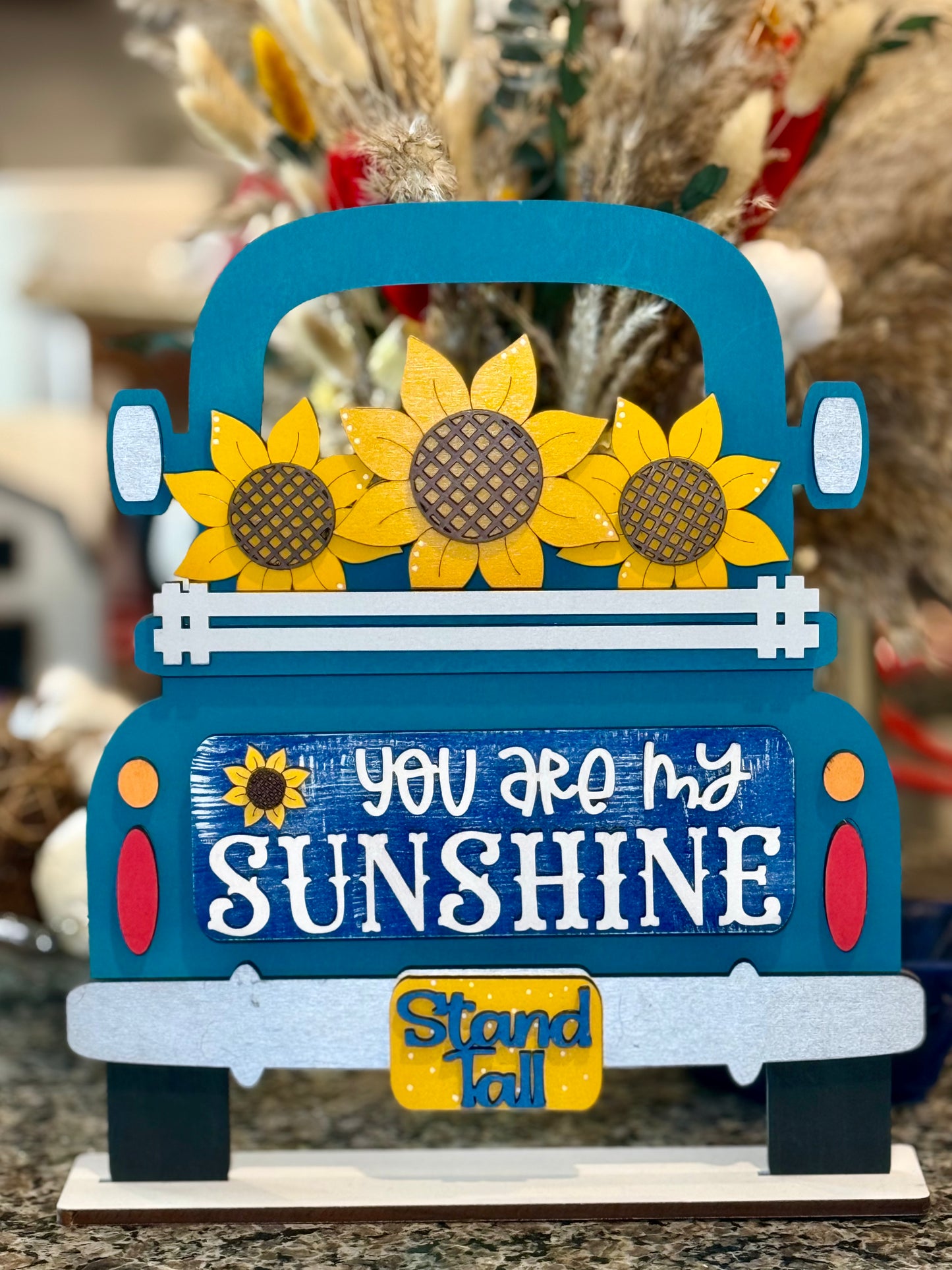 Handcrafted wooden interchangeable truck insert featuring a vibrant 'Hello Sunshine' message and hand-painted yellow sunflowers for farmhouse truck sign or shelf sitter.
