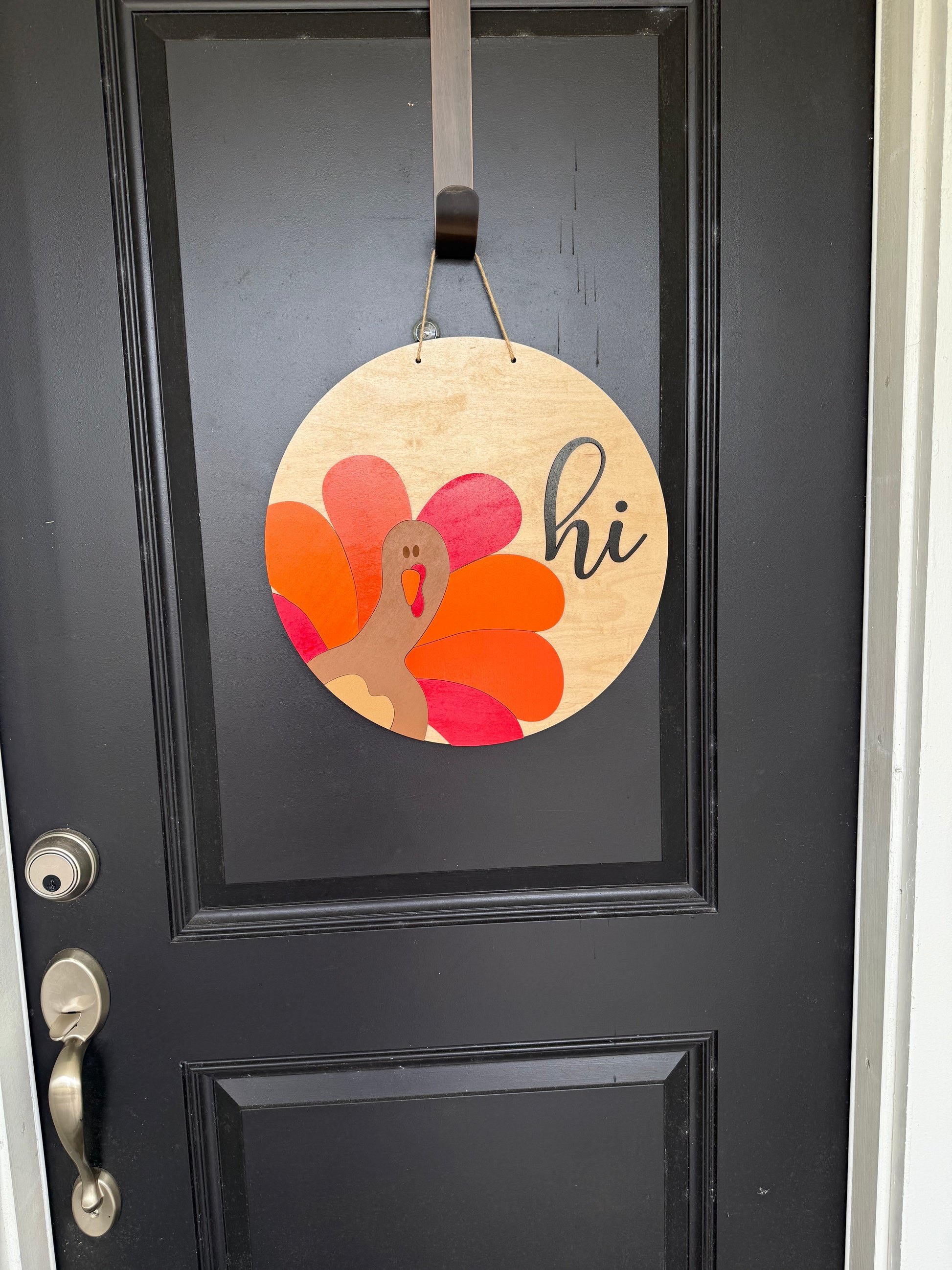 Handmade wood sign with a cute turkey & hi on it